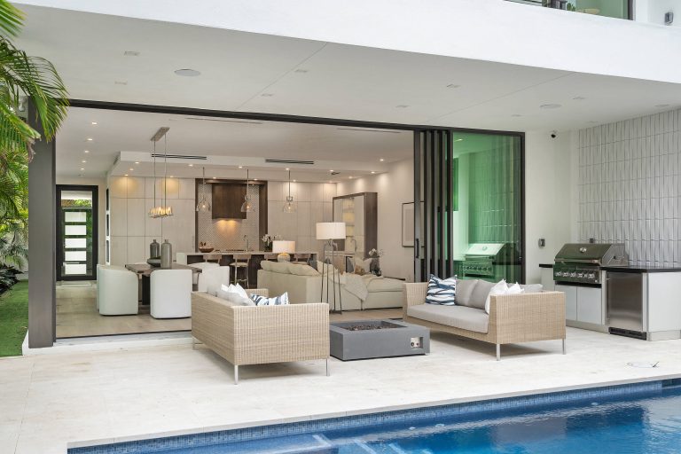 Trendy tile patio kitchen photo in Miami with a roof extension