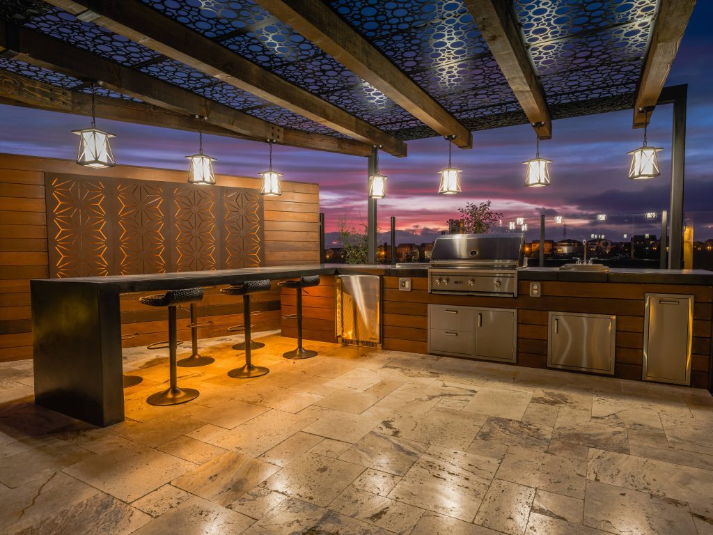 Trendy tile patio kitchen photo in San Diego with a pergola