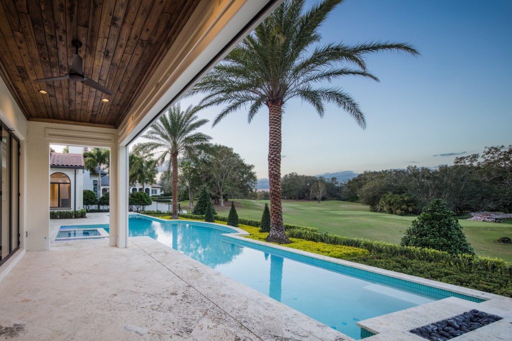 Tuscan backyard custom-shaped lap hot tub photo in Jacksonville
