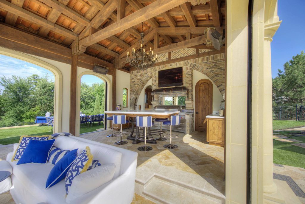 Tuscan backyard tile patio kitchen photo in Minneapolis with a gazebo