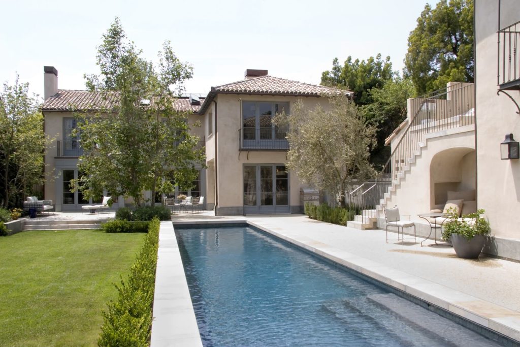 Tuscan courtyard rectangular lap pool photo in Los Angeles