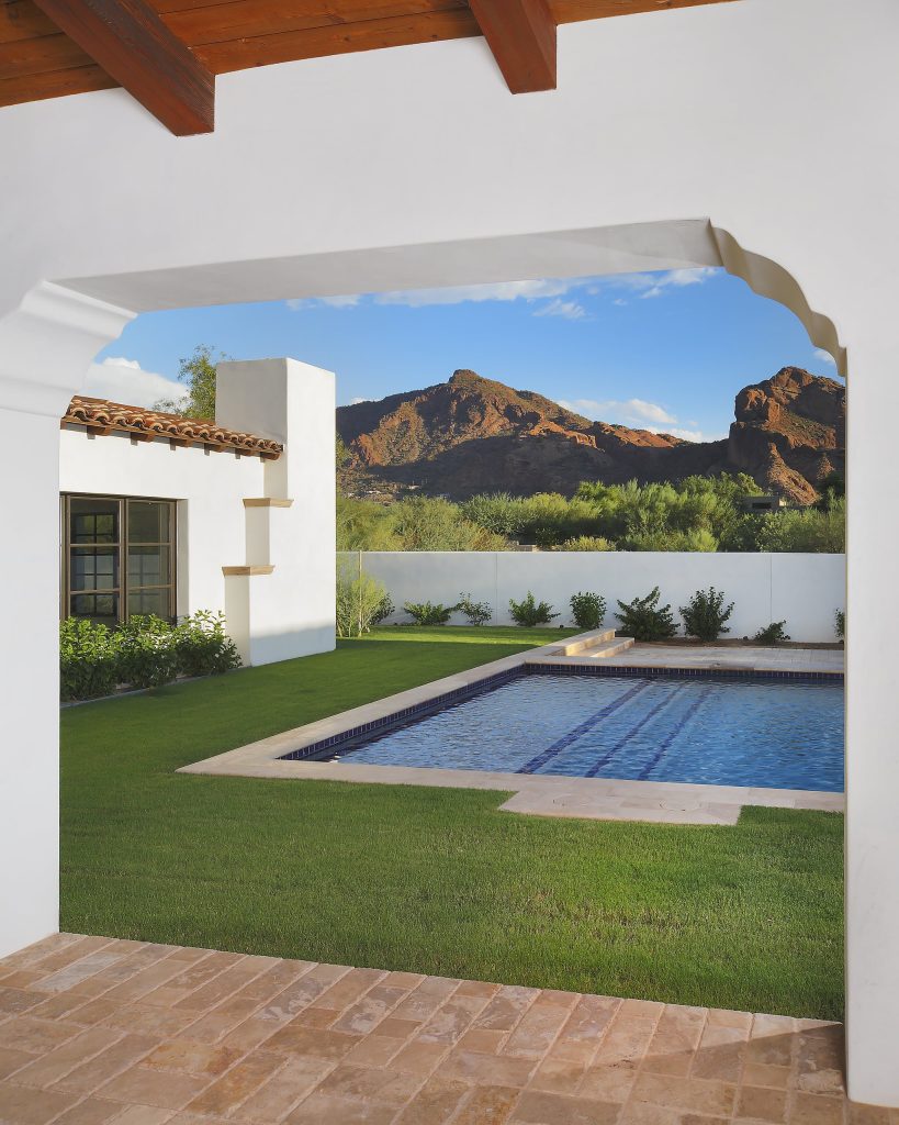 Tuscan courtyard rectangular pool photo in Phoenix