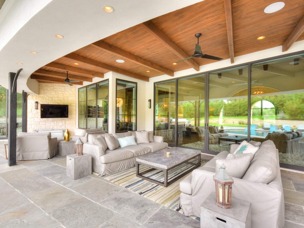 Tuscan porch photo in Austin with a roof extension by Vanguard Studio Inc. | Outdoor Photos | Porch | Landscaping | Landscape Design | Outdoor Living Space | Porch Design Ideas | Outdoor Living Space Ideas | Backyard Design