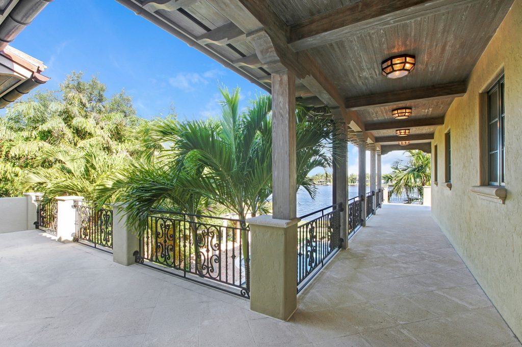 Tuscan porch photo in Miami by Neandross Estate Homes | Outdoor Photos | Porch | Landscaping | Landscape Design | Outdoor Living Space | Porch Design Ideas | Outdoor Living Space Ideas | Backyard Design