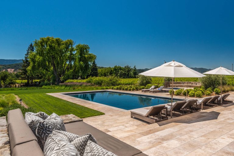 Tuscan stone and rectangular lap pool photo in San Francisco