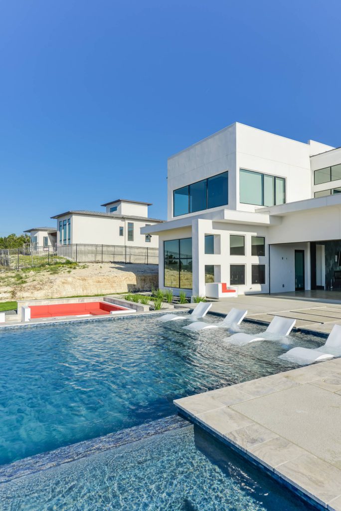 Two story Modern House locate it in Cresta Bella San Antonio, Texas with amazing hill country and downtown views, house was design by OSCAR E FLORES DESIGN STUDIO