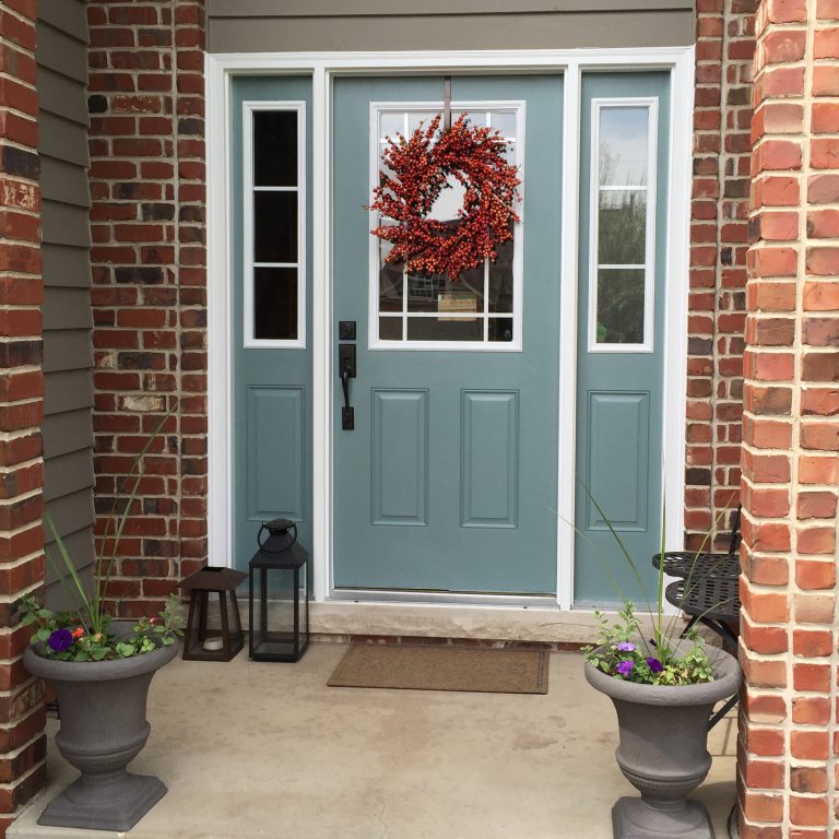 Updated front door with new windows and paint.