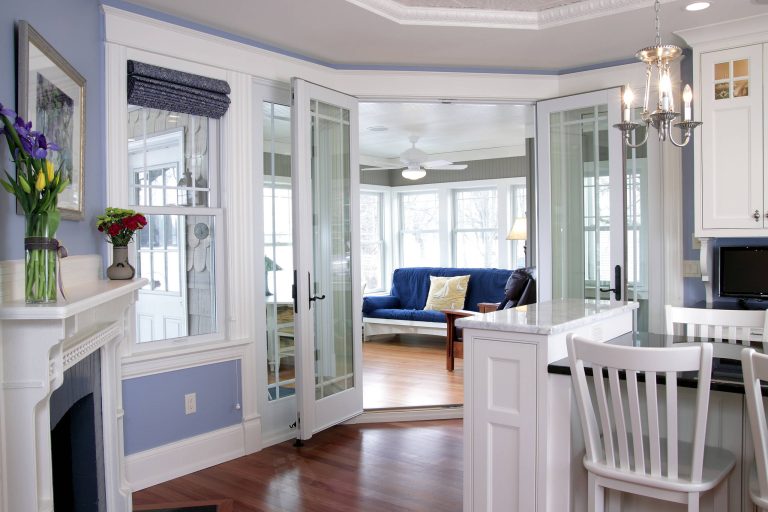 View from the kitchen into the year-round lake porch Photo Credit: Erol Reyal