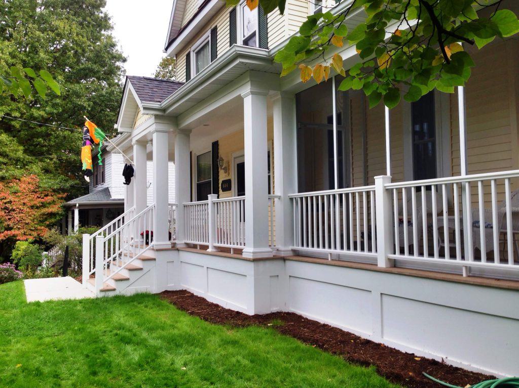 View of entry porch and adjacent screened porch.