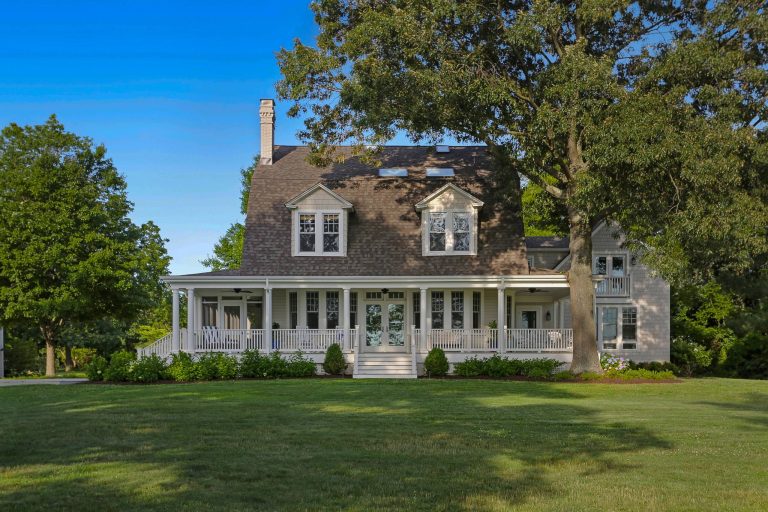 View of front porch of renovated 1914 Dutch Colonial farm house. © REAL-ARCH-MEDIA