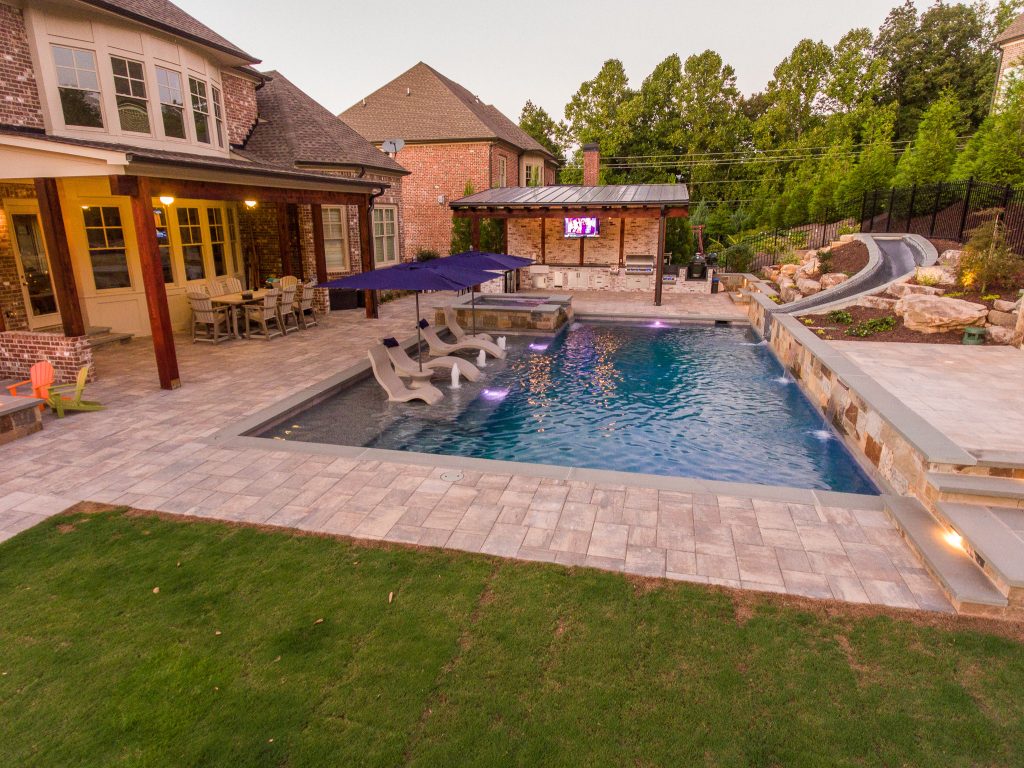 Water slide - mid-sized contemporary backyard concrete paver and rectangular lap water slide idea in Atlanta