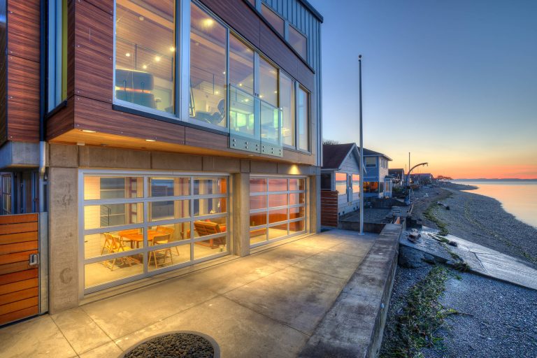 Waterside terrace at twilight. Photography by Lucas Henning.