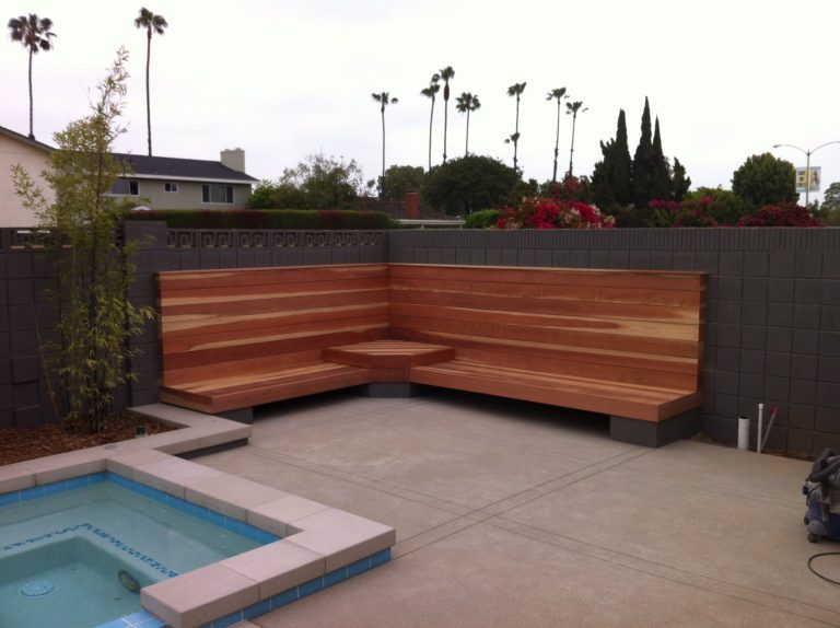 We created an outdoor bench to accompany the pool made of redwood. The client upholstered their own cushions tailored to their own design.