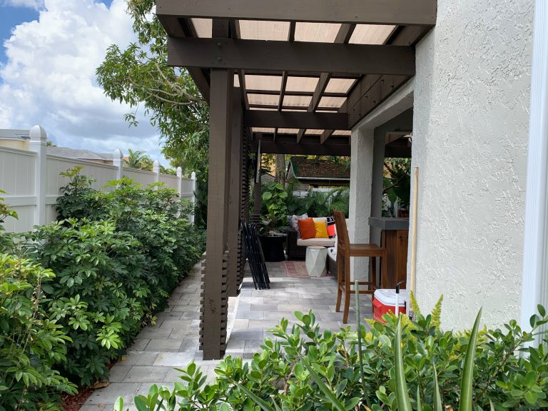 We extended her patio by covering the side of her house to maximize the space