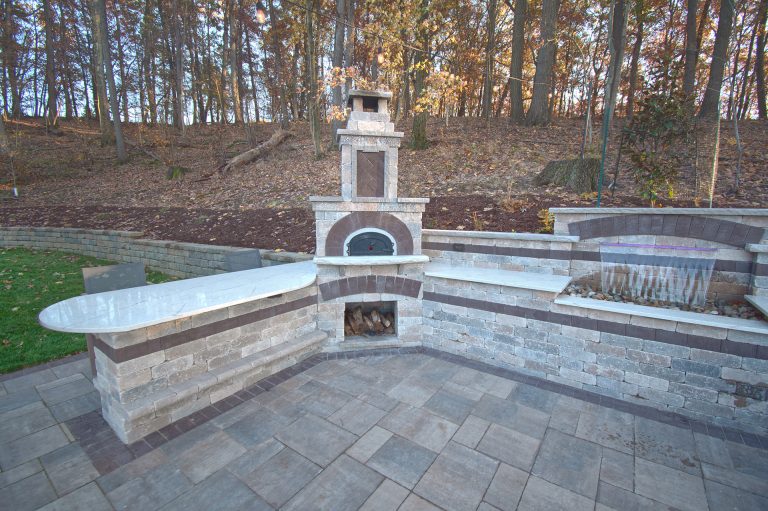 We installed a large Chicago brick oven using Unilock Brussels river blend with El Campo Mocha accents for the masonry work (pizza oven, bar and oversized fireplace).