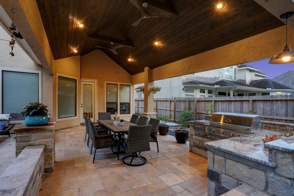 We poured a total of 1600SF of concrete and covered it with light brushed and chiseled edge travertine from QDI. It is laid in a Versaillas pattern. All of the selections blend seamlessly. TK Images