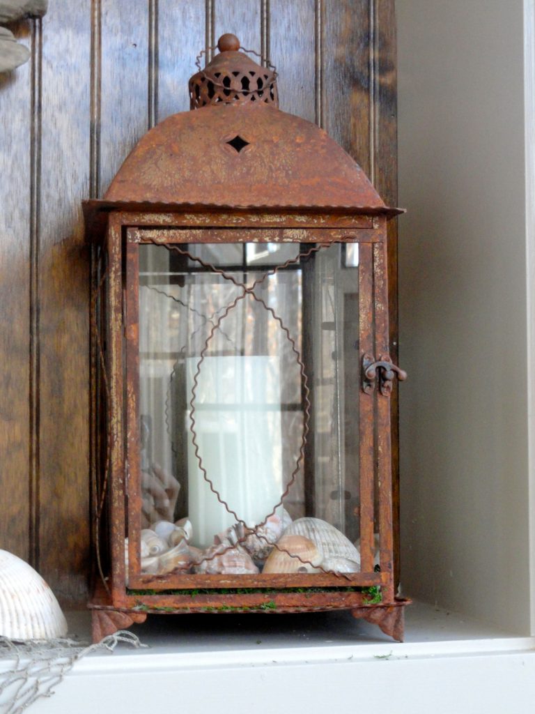 We wanted the light of a lantern, but wanted to look like it had been outside for ages.