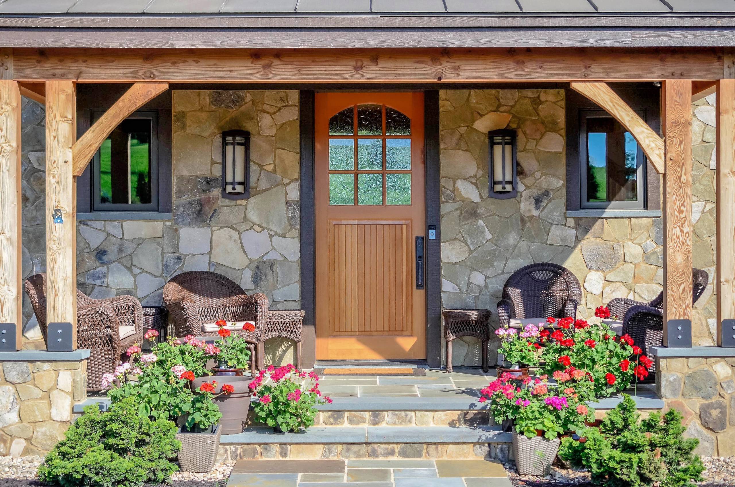 Wes Ellis
Inspiration for a mid-sized rustic stone front porch remodel in Other