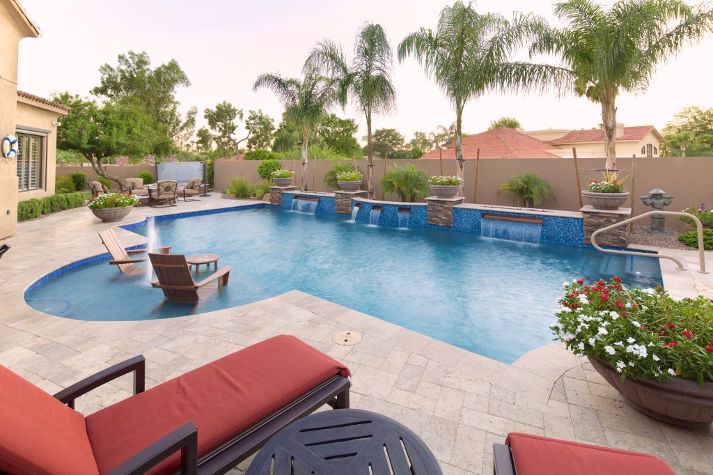 When the baja shelf is being used for relaxing, there are steps and a safety handrail near the back of the pool.
