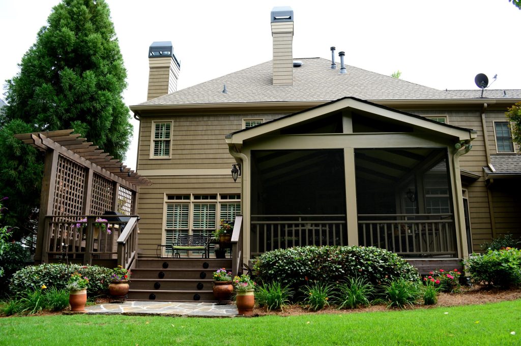 Whole exterior renovation! Stucco to wood paneling siding, screened porch and deck!