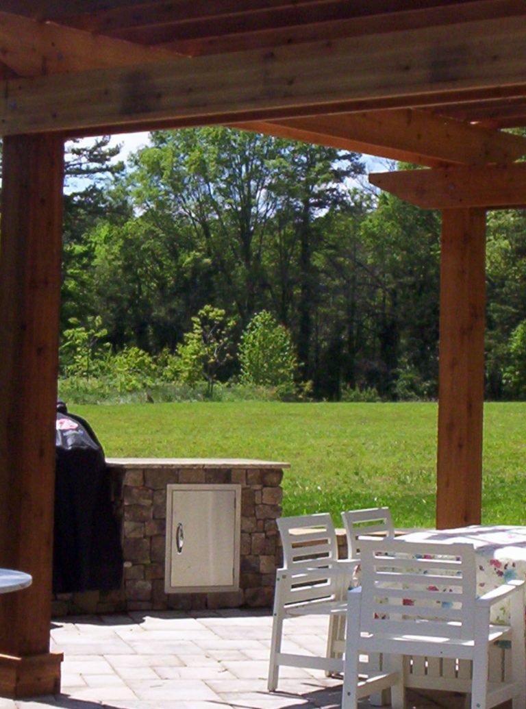 Wonderful outdoor living space/kitchen with stainless steel, granite counter tops, awesome seating walls and pergola.