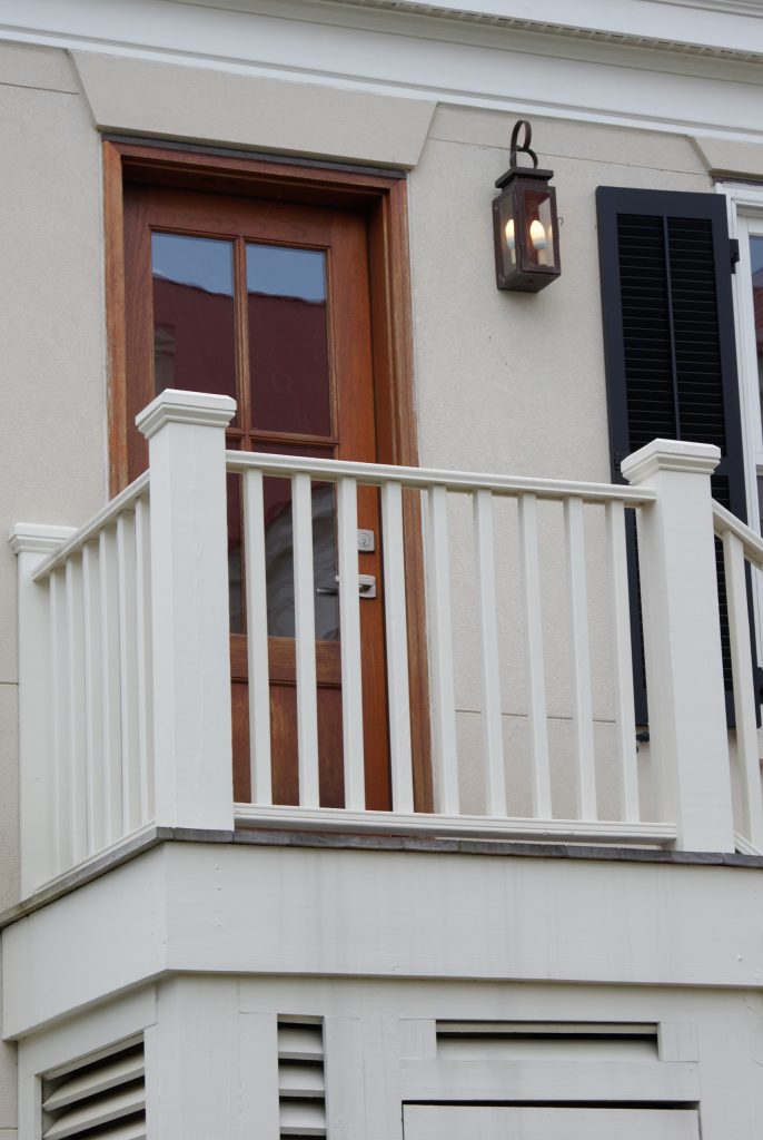 Yacht Basin wall mounted electric lantern that lights the way at night to a second story side entrance door.