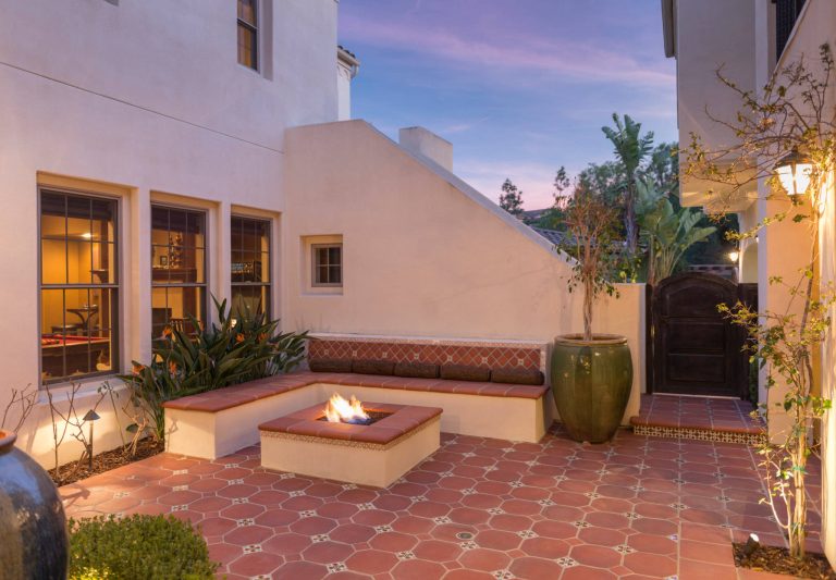 This is the homes inner courtyard featuring Terra-cotta tile paving with hand-painted Mexican tile keys, a fire pit and bench.

Photographer: Riley Jamison
Realtor: Tim Freund,
website: tim@1000oaksrealestate.com by The Design Studio of Wendy Harper | Fire Pits|Backyard Design|Outdoor Living Spaces|Landscape Design|Backyard Ideas|Landscaping|Landscaping Ideas|Landscape Installation|Fire Feautures|Fire Pit