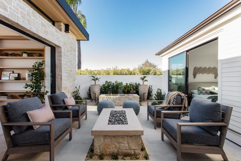 Trendy courtyard concrete patio photo in Los Angeles with a fire pit and no cover