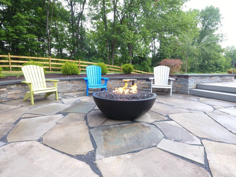 Patio - mid-sized traditional backyard stone patio idea in Philadelphia with a fire pit and no cover