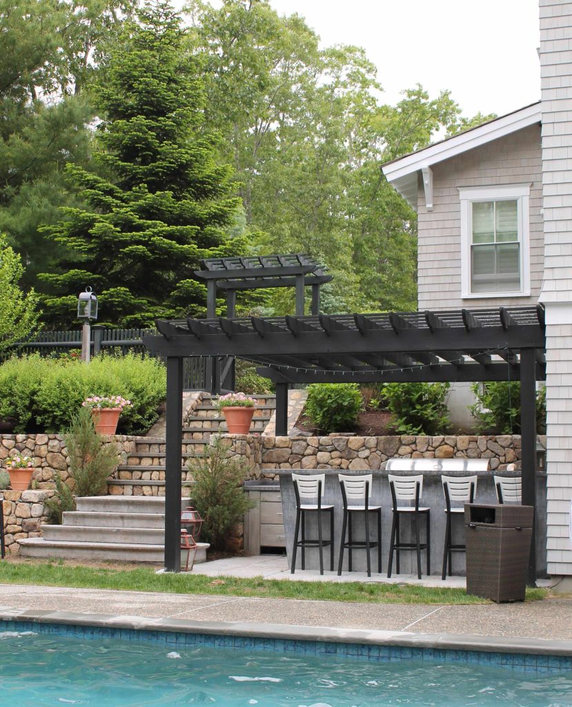 bar stools, custom outdoor kitchen, concrete counter, grilling, indoor outdoor living, outdoor bar, outdoor cooking, outdoor entertaining, pool, patio seating, poolside bar
