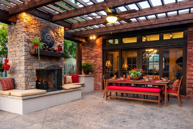 The large rough cedar pergola provides a wonderful place for the homeowners to entertain guests. The decorative concrete patio used an integral color and release, was scored and then sealed with a glossy finish. There was plenty of seating designed into the patio space and custom cushions create a more comfortable seat along the fireplace.

Jason Wallace Photography by Tanner Consulting LLC- Landscape Architecture | Fire Pits|Backyard Design|Outdoor Living Spaces|Landscape Design|Backyard Ideas|Landscaping|Landscaping Ideas|Landscape Installation|Fire Feautures|Fire Pit
