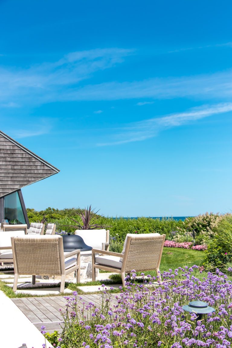 Inspiration for a coastal backyard patio remodel in New York with a fire pit and no cover