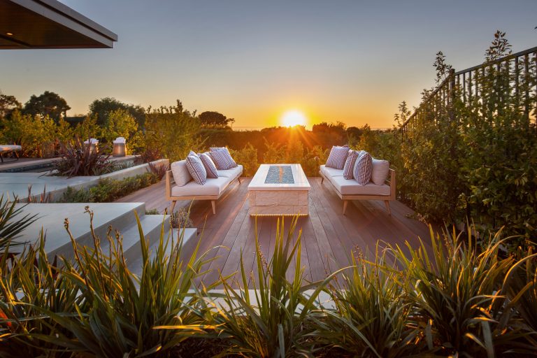 Trendy backyard deck photo in Orange County with a fire pit and no cover