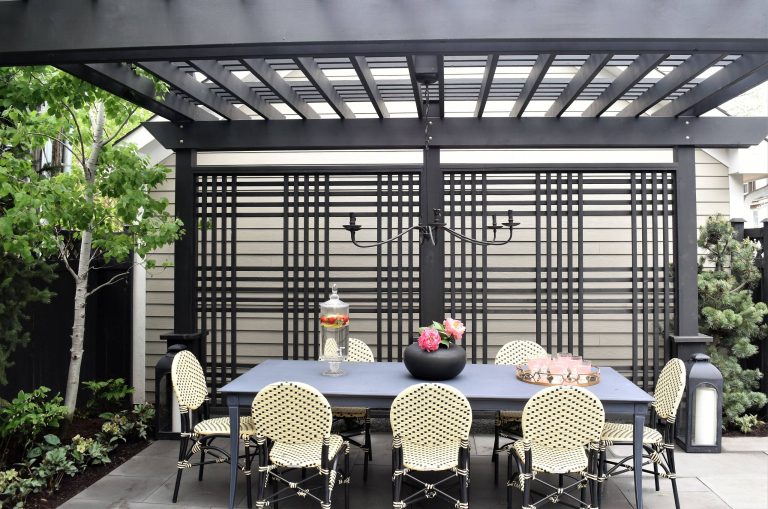 Example of a small trendy backyard stone patio design in Chicago with a fire pit and a pergola