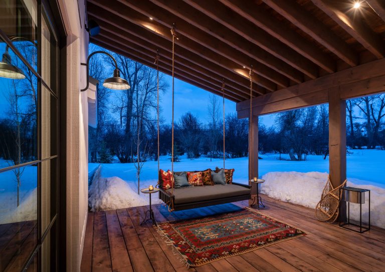 cabin, country home, covered porch, custom home, modern farmhouse, mountain home, natural materials, porch swing, rustic wood, snow