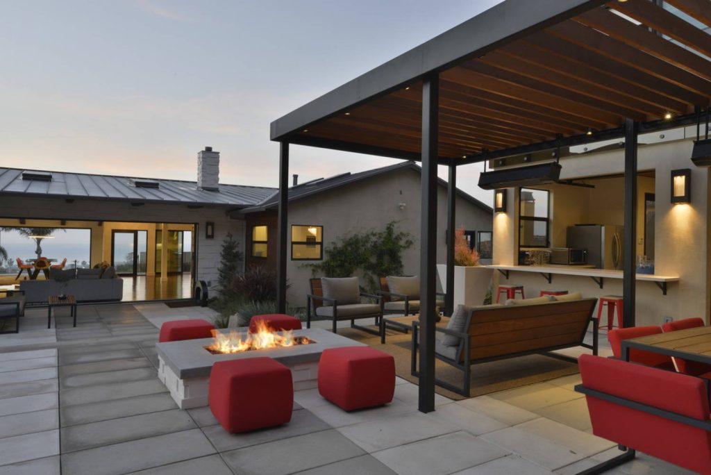 Patio - contemporary courtyard concrete patio idea in San Diego with a fire pit and a pergola