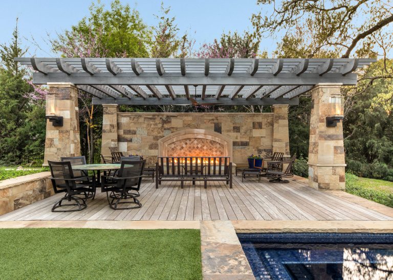 Tuscan backyard deck photo in Dallas with a fire pit and a pergola