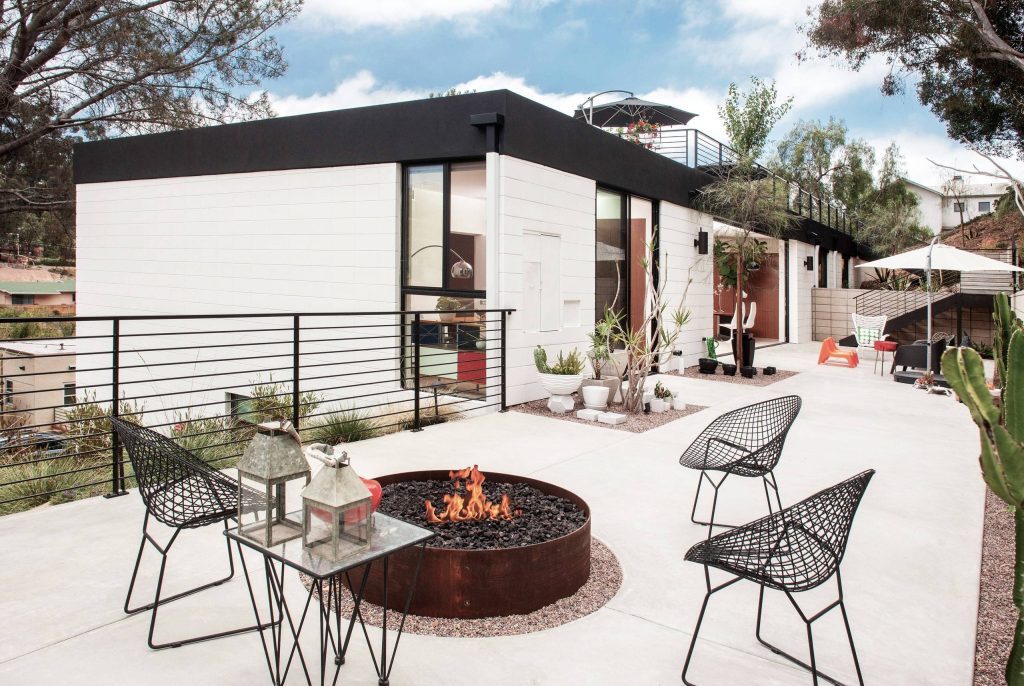 Inspiration for a contemporary backyard concrete patio remodel in San Diego with a fire pit and no cover