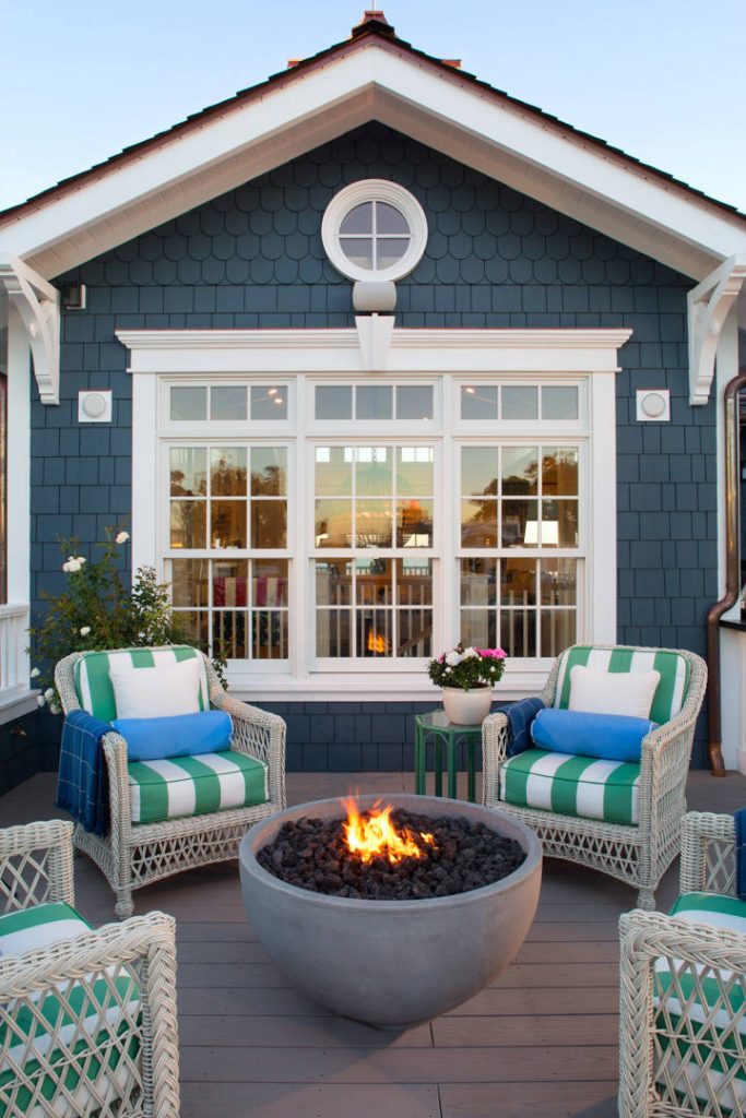 The upstairs deck on this beautiful beachfront home features a fire bowl that perfectly complements the deck and surroundings. O McGoldrick Photography