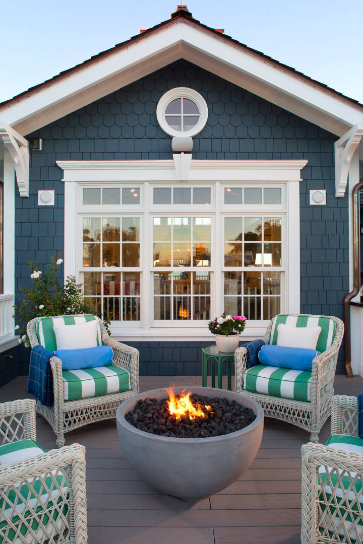 The upstairs deck on this beautiful beachfront home features a fire bowl that perfectly complements the deck and surroundings. O McGoldrick Photography