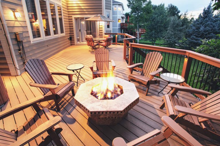 Deck - large traditional backyard deck idea in Denver with a fire pit and no cover