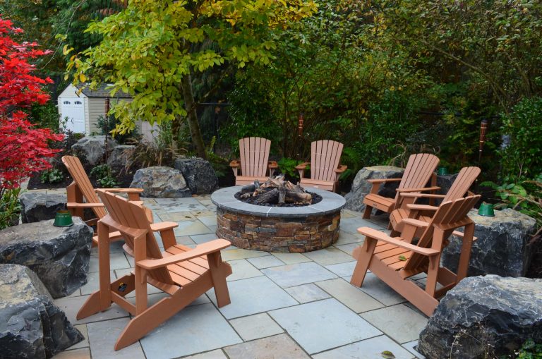 Example of a trendy patio design in Seattle with a fire pit and no cover