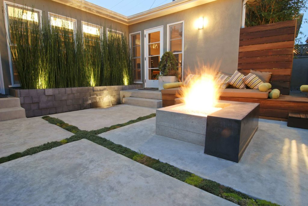 Inspiration for a contemporary concrete patio remodel in San Diego with a fire pit and no cover