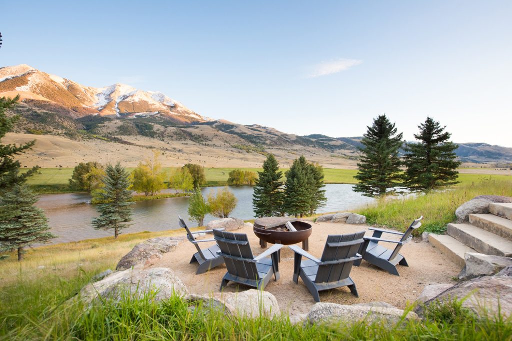 Gathering Area. Sustainable Landscape Architecture design. Naturalistic design style, highlighting the architecture and situating the home in it's natural landscape within the first growing season. Large Private Ranch in Emigrant, Montana. Architecture by Formescent Architects | Photography by Jon Menezes