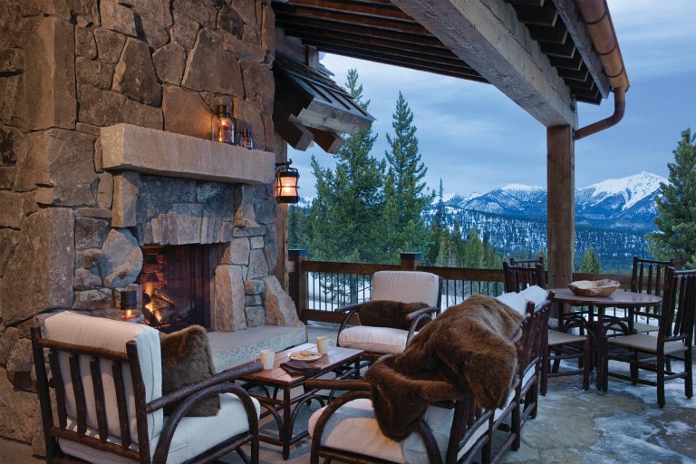 Fire Pit Ideas Designed as a prominent display of Architecture, Elk Ridge Lodge stands firmly upon a ridge high atop the Spanish Peaks Club in Big Sky, Montana. Designed around a number of principles; sense of presence, quality of detail, and durability, the monumental home serves as a Montana Legacy home for the family. Throughout the design process, the height of the home to its relationship on the ridge it sits, was recognized the as one of the design challenges. Techniques such as terracing roof lines, stretching horizontal stone patios out and strategically placed landscaping; all were used to help tuck the mass into its setting. Earthy colored and rustic exterior materials were chosen to offer a western lodge like architectural aesthetic. Dry stack parkitecture stone bases that gradually decrease in scale as they rise up portray a firm foundation for the home to sit on. Historic wood planking with sanded chink joints, horizontal siding with exposed vertical studs on the exterior, and metal accents comprise the remainder of the structures skin. Wood timbers, outriggers and cedar logs work together to create diversity and focal points throughout the exterior elevations. Windows and doors were discussed in depth about type, species and texture and ultimately all wood, wire brushed cedar windows were the final selection to enhance the "elegant ranch" feel. A number of exterior decks and patios increase the connectivity of the interior to the exterior and take full advantage of the views that virtually surround this home. Upon entering the home you are encased by massive stone piers and angled cedar columns on either side that support an overhead rail bridge spanning the width of the great room, all framing the spectacular view to the Spanish Peaks Mountain Range in the distance. The layout of the home is an open concept with the Kitchen, Great Room, Den, and key circulation paths, as well as certain elements of the upper level open to the spaces below. The kitchen was designed to serve as an extension of the great room, constantly connecting users of both spaces, while the Dining room is still adjacent, it was preferred as a more dedicated space for more formal family meals. There are numerous detailed elements throughout the interior of the home such as the "rail" bridge ornamented with heavy peened black steel, wire brushed wood to match the windows and doors, and cannon ball newel post caps. Crossing the bridge offers a unique perspective of the Great Room with the massive cedar log columns, the truss work overhead bound by steel straps, and the large windows facing towards the Spanish Peaks. As you experience the spaces you will recognize massive timbers crowning the ceilings with wood planking or plaster between, Roman groin vaults, massive stones and fireboxes creating distinct center pieces for certain rooms, and clerestory windows that aid with natural lighting and create exciting movement throughout the space with light and shadow. by Centre Sky Architecture Ltd | Fire Pits|Backyard Design|Outdoor Living Spaces|Landscape Design|Backyard Ideas|Landscaping|Landscaping Ideas|Landscape Installation|Fire Feautures|Fire Pit