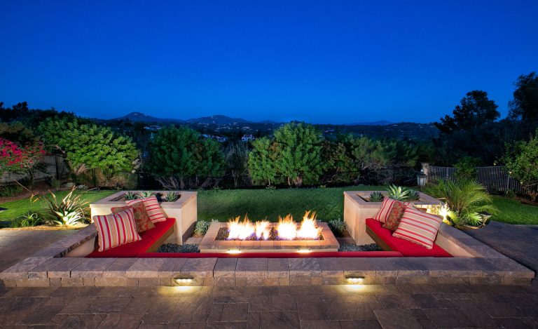 Inspiration for a mediterranean patio remodel in San Diego with a fire pit