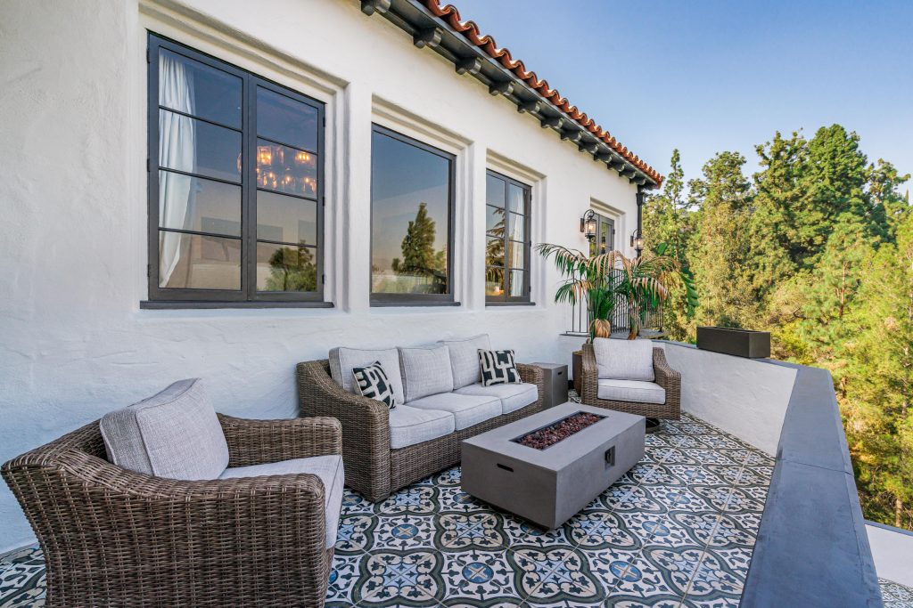 Inspiration for a mediterranean balcony remodel in Los Angeles with a fire pit