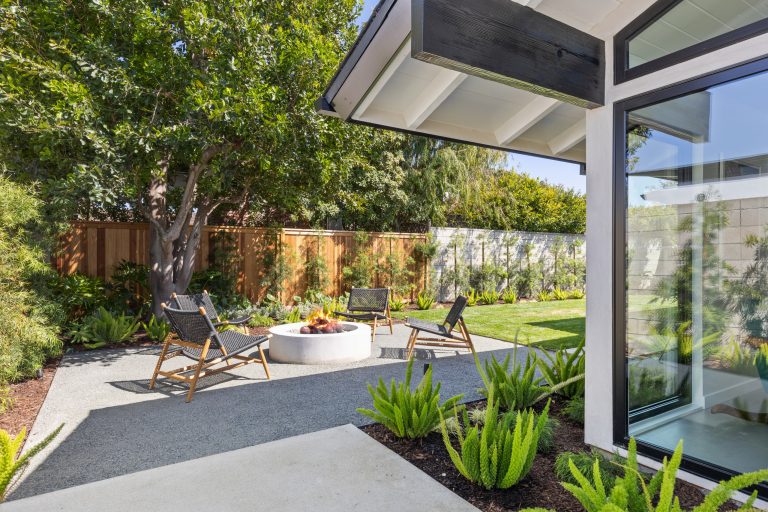 1950s gravel patio photo in Orange County with a fire pit and no cover