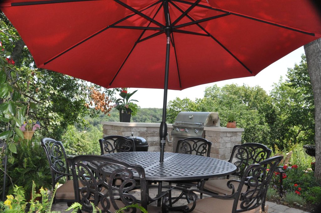 fire feature, retaining wall, annual flower pots, existing stone wall