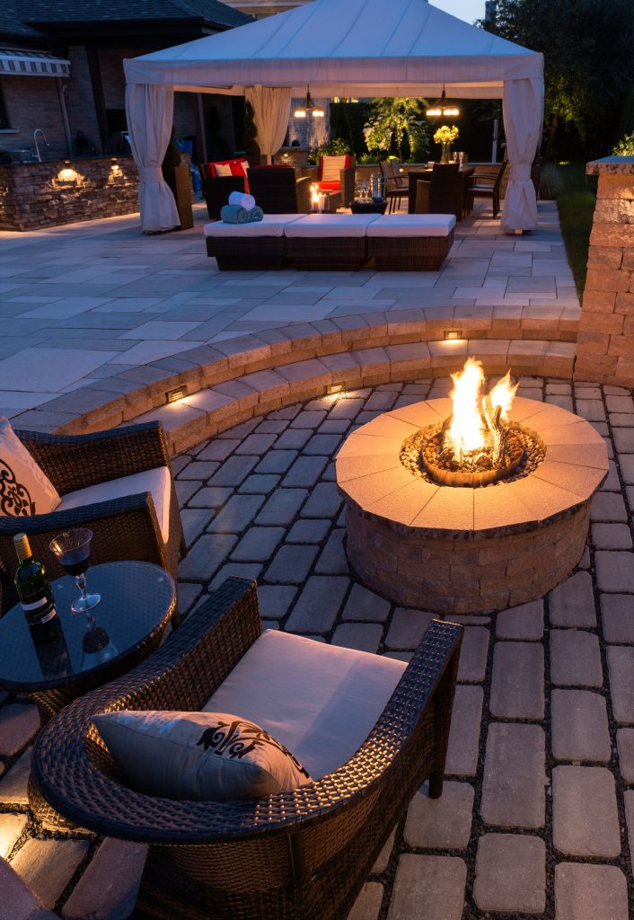 Rustic Style Fire Feature - Techo-Bloc's Valencia Fire Pit with custom caps.
